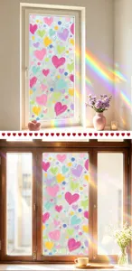 Detail view of heart pattern window film creating a vibrant rainbow prism effect