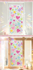 Heart patterned static window film showing colorful prism light effect on glass
