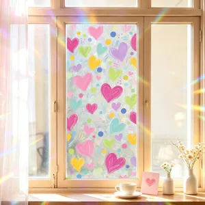 Colorful heart-patterned static glass window film for festive home decor and privacy.