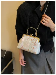 Elegante borsa a mano ricamata con fiori in stile cinese e una tracolla dorata