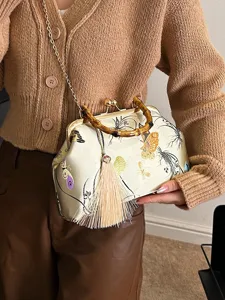 Elegante bolso de mano vintage con asa de bambú, estampado de mariposas y borla larga