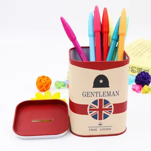 Square metal tin piggy bank and pen holder in British gentleman style with colored pens.