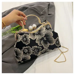 Close-up of Chinese style handbag with exquisite floral embroidery and pearl clasp