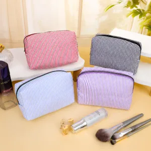 Large capacity striped embroidered cosmetic bag, portable travel toiletry storage pouch for daily use.