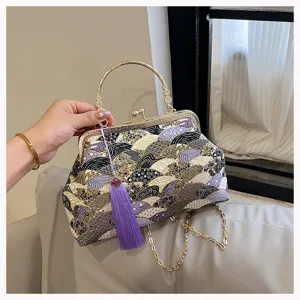 Squisita borsa a mano in stile cinese con chiusura a scatto e nappa viola elegante