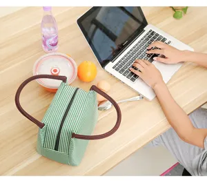 Insulated lunch bag canvas portable thermal food container green striped picnic bag detail view