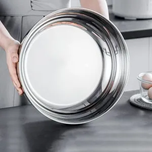 Thickened stainless steel kitchen mixing bowl detail view, ideal for washing vegetables and baking.