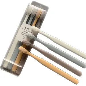 Japanese macaron soft bristle toothbrush set with transparent storage box for daily dental care.