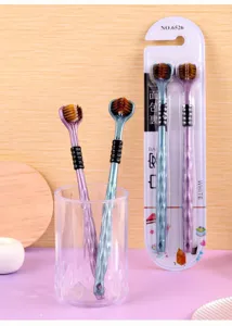 Detailed view of three sided soft bristle adult toothbrush with 3D design and package.