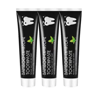 Detail view of bamboo charcoal toothpaste tubes, mint flavor, fresh breath and clean teeth.