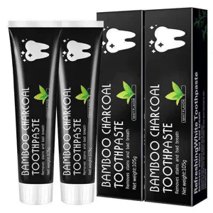 Bamboo charcoal toothpaste detail view showing 105g tubes and boxes with mint flavor and whitening effect.