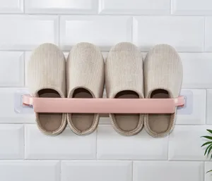 Wall-mounted slipper rack bathroom shoe storage organizer detail view showing compact design.