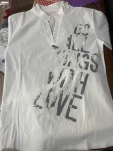Casual white V-neck top for women with stylish graphic letter print, comfortable daily wear.