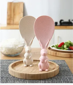 Detail view of cute standing rabbit rice spoon made of wheat straw, non-stick surface.