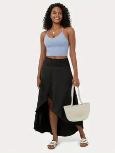 Summer women's fashion irregular long skirt and casual camisole outfit for daily commuting.
