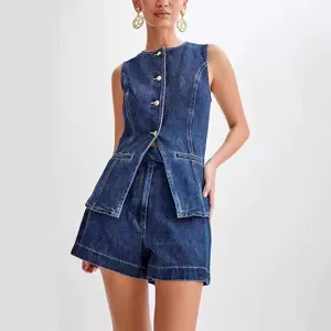 Detailed view of the dark blue denim sleeveless vest and high waist shorts set, metal buttons.