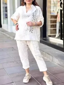 Casual white two-piece lounge set with half-sleeve top and trousers, letter print.