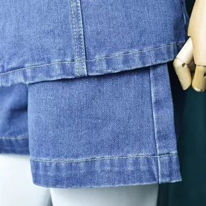 Blue denim shorts set detail shot showing clean stitching and high quality fabric texture.
