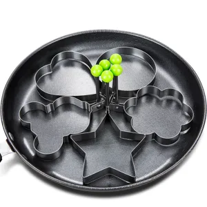Stainless steel egg frying mold set, multiple fun shapes with green handles for breakfast.
