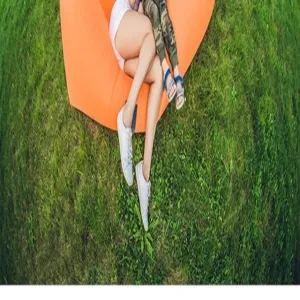 Portable outdoor inflatable sofa air bed for camping and park relaxing. Durable waterproof material.