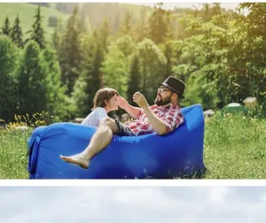 Outdoor inflatable lazy sofa air bed for camping park relaxation, portable blue air lounger.