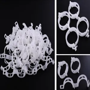 Plastic plant fixing clips for tomatoes and vines, durable greenhouse support hooks.