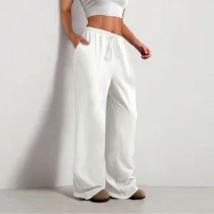 Vista dettagliata dei pantaloni casual larghi bianchi da donna con vita alta e coulisse.