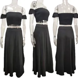 Detailed view of the black off-shoulder crop top and long skirt set, showing the fit.