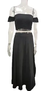 Black two-piece summer outfit featuring an off-the-shoulder crop top and matching long maxi skirt.