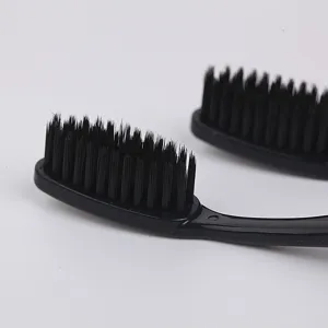 10-pack soft bristle charcoal toothbrushes for daily family oral care, black color design.