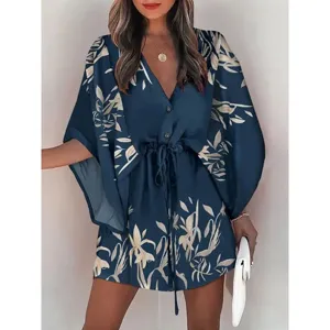 Detailed view of the blue floral print beach dress with V-neck and drawstring waist design.