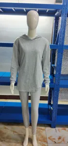 Grey ribbed knit hoodie and trousers two piece set, casual long sleeve loungewear detail.
