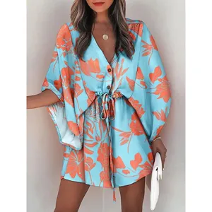 Close-up detail of the women's light blue floral print V-neck beach dress with adjustable drawstring waist.