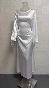 White long sleeve satin midi dress, elegant crew neck design with fitted waist silhouette.