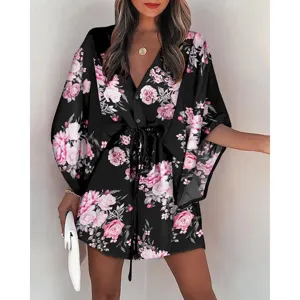 Detailed view of the women summer floral V-neck beach dress, featuring chic print and ties.