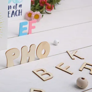 Natural wooden alphabet letters for DIY crafts and early childhood educational learning toys.