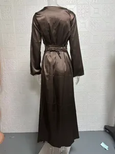 Brown satin long-sleeve maxi dress with back waist tie, elegant and minimalist style.