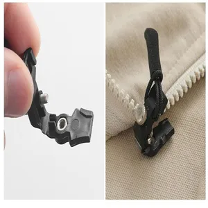 Detachable zipper repair head close-up, black plastic and metal screw for luggage and bags.