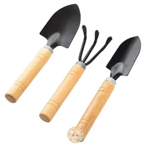 Gardening tool set with three pieces including shovels and rake with wooden handle for plants.