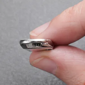 Detachable metal zipper pull tab with built-in spring mechanism for bags and jackets main view
