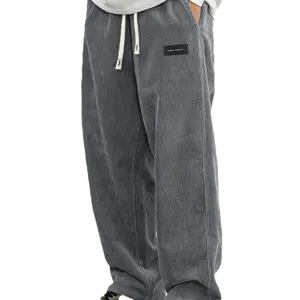 Pantalon décontracté ample pour homme en velours côtelé gris avec cordon et badge logo.