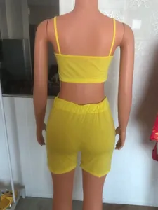 Back view detail of the yellow two-piece crop top and shorts set on mannequin, casual wear.