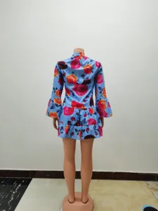 Detailed back view of vintage floral print long sleeve dress with ruffle hem for women.