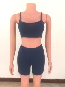 Detail view of dark blue sleeveless crop top and matching shorts, casual athletic two-piece set.
