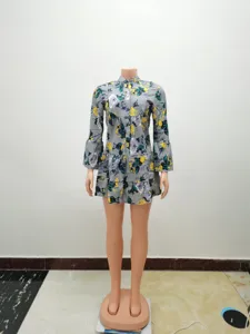 Women's vintage floral print long sleeve mini dress with ruffled swing hem detail.