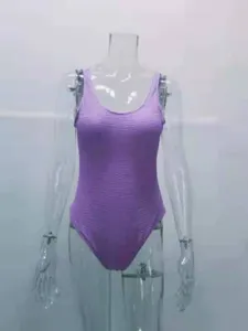 Women's purple one-piece swimsuit featuring a trendy crinkle textured fabric and u-neck design.