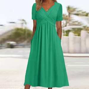 Solid green short sleeve V-neck crossover midi dress with pockets for women summer casual wear.