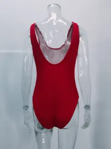 Red crinkle one-piece swimsuit for women with scoop back design, detail view.