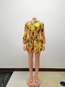 Floral print long bell sleeve dress detail view, vintage style stand collar design showcase.