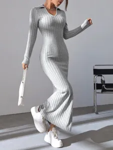 Detail shot of grey ribbed knit long dress, elegant slim fit long sleeve maxi dress style.